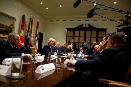 U.S. President Donald Trump (3rd L) meets with Fraternal Order of Police leaders at the White House in Washington, U.S., March 28, 2017. REUTERS/Jonathan Ernst