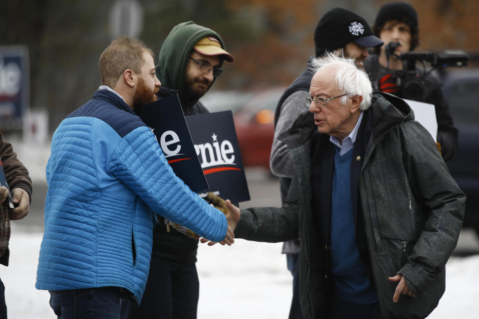 Sen. Bernie Sanders, I-Vt., meets with people outside a polling place where voters will cast their ballots in a primary election, in Manchester, N.H. (Matt Rourke/AP)