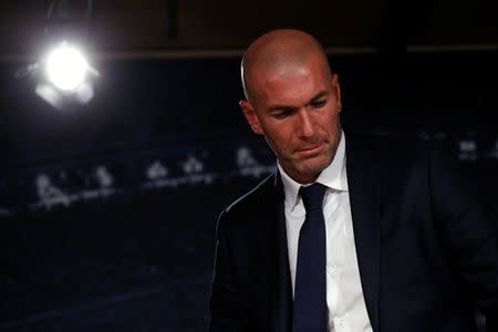 Real Madrid's new coach Zinedine Zidane leaves after a news conference at Santiago Bernabeu stadium in Madrid, Spain, January 5, 2016. REUTERS/Juan Medina