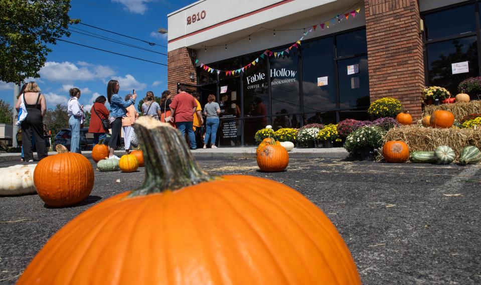 Attendees wait in line to enter Fable Hollow Coffee & Bookshoppe during its first fall festival Sept. 23, 2023, in Knoxville, Tennessee.