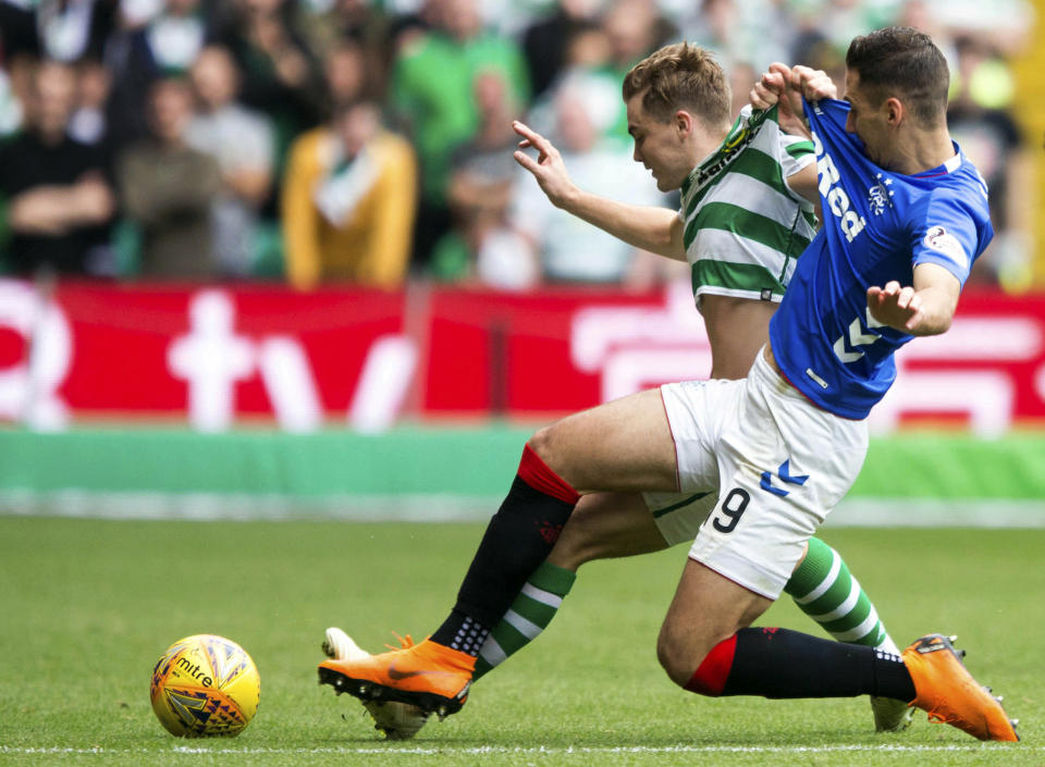 Celtic's James Forrest, background, battles for the ball with Rangers' Nikola Katic, during the Scottish Premiership soccer match between Celtic and Rangers, at Celtic Park, in Glasgow, Scotland, Sunday, Sept. 2, 2018. (Jeff Holmes/PA via AP)