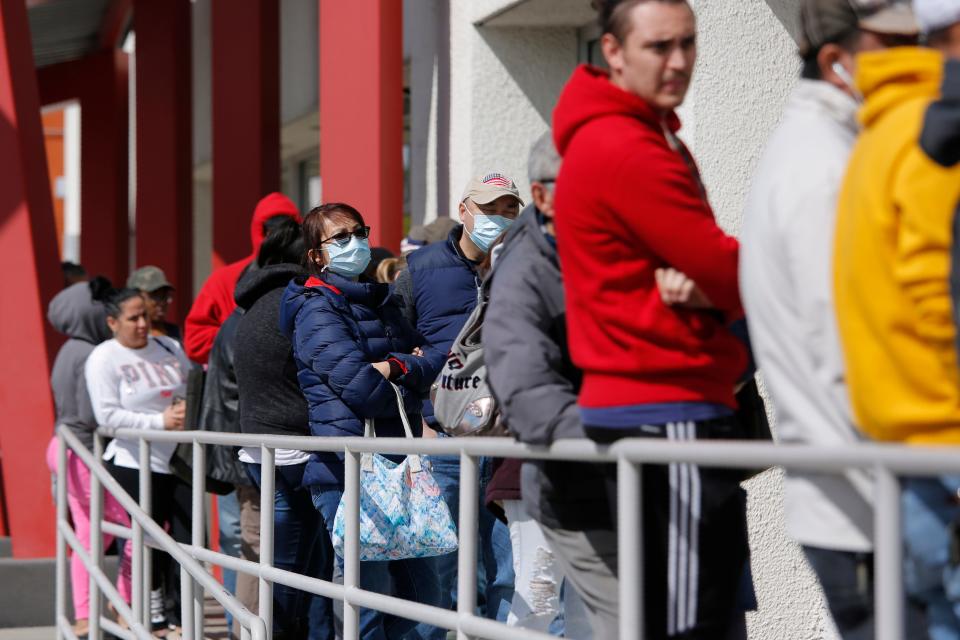 ID thieves are filing fake unemployment claims, taking advantage of the economic unrest during the COVID-19 crisis. In this March 17, 2020, file photo, people wait in line for help with unemployment benefits at the One-Stop Career Center in Las Vegas. T (AP Photo/John Locher, File)