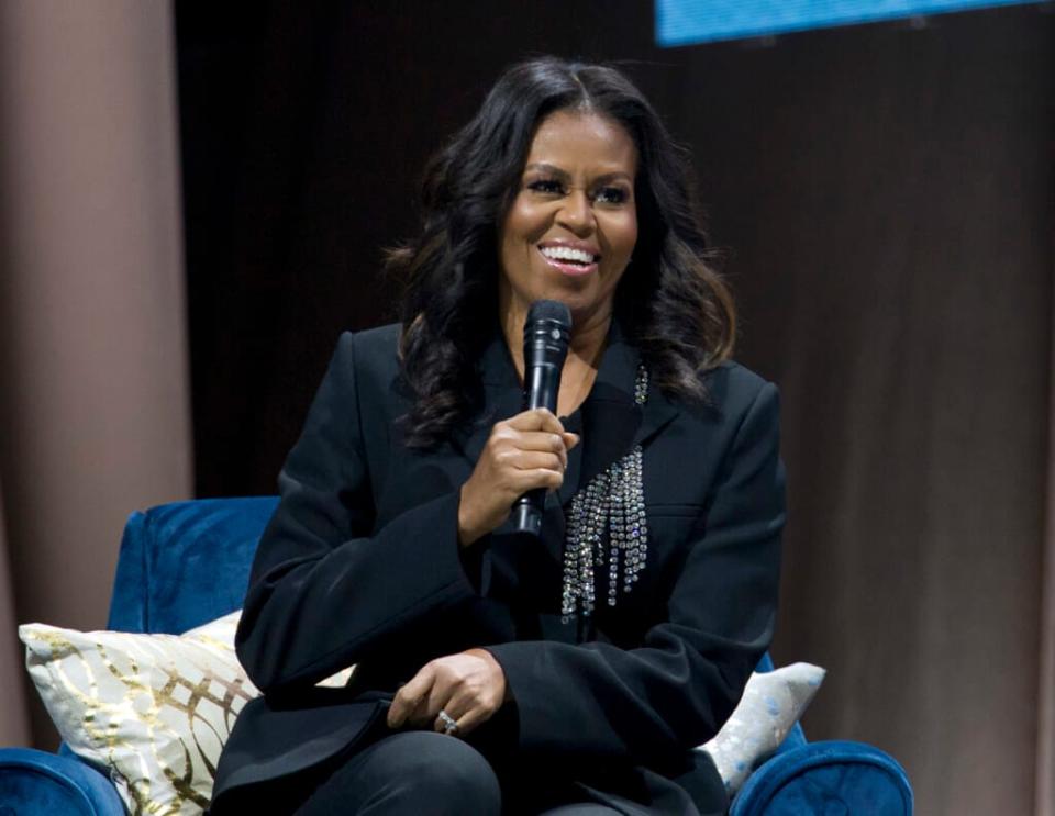 Former first lady Michelle Obama speaks to the crowd as she presents her anticipated memoir “Becoming” during her book tour stop in Washington, on Nov. 17, 2018. (AP Photo/Jose Luis Magana, File)