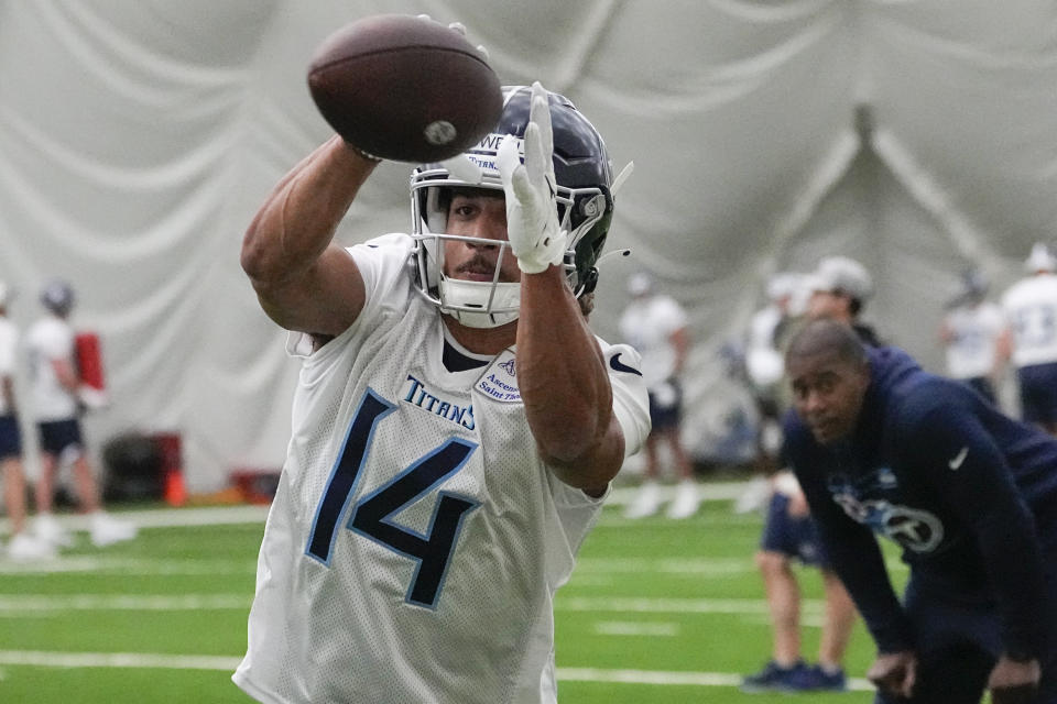 Tennessee Titans wide receiver Colton Dowell (14) pulls in a catch during the NFL football team's rookie minicamp, Saturday, May 13, 2023, in Nashville, Tenn. (AP Photo/George Walker IV)