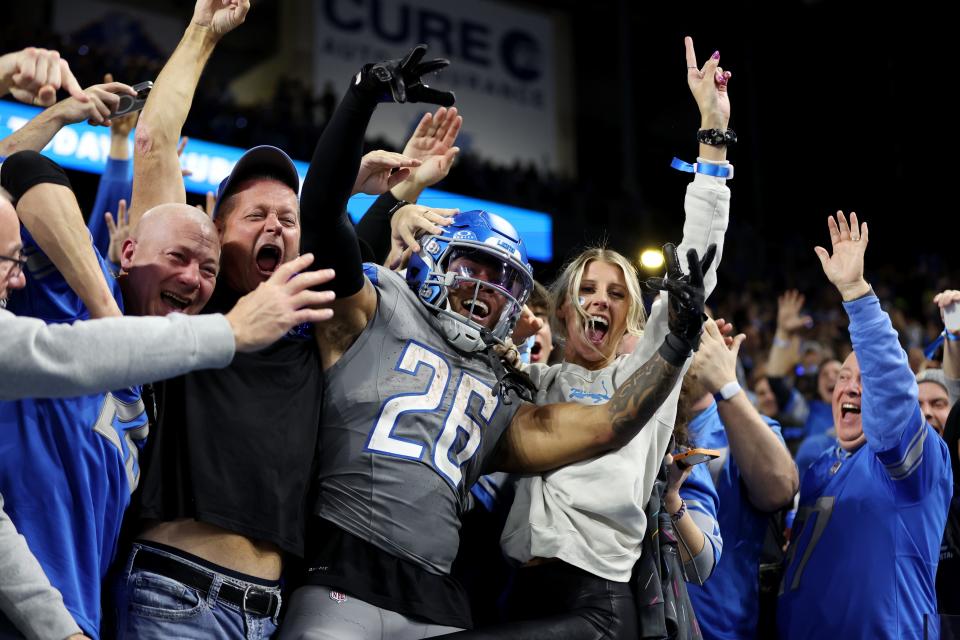 Jahmyr Gibbs #26 of the Detroit Lions celebrates his touchdown with fans in the third quarter against the Las Vegas Raiders at Ford Field on October 30, 2023 in Detroit, Michigan.