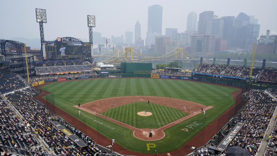 Haze from Canadian wildfires hangs over downtown Pittsburgh and PNC Park during a baseball game between the Pittsburgh Pirates and the San Diego Padres in Pittsburgh, Thursday, June 29, 2023. (AP Photo/Gene J. Puskar)