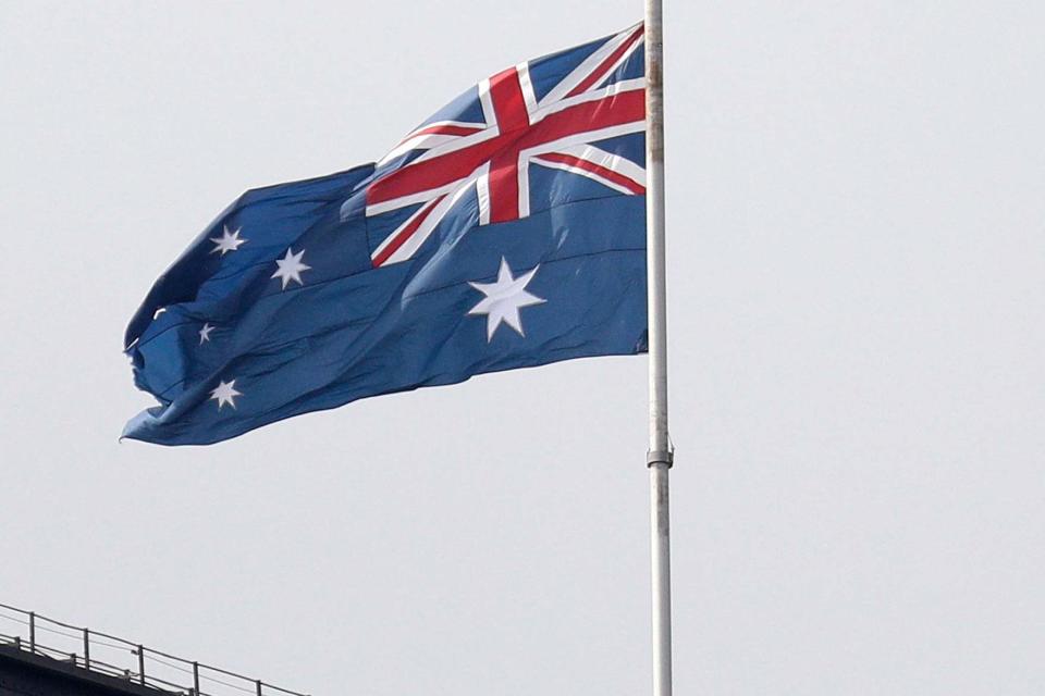 Tragedy: a flag flying at half mast today on Sydney Harbour Bridge in honour (AP)