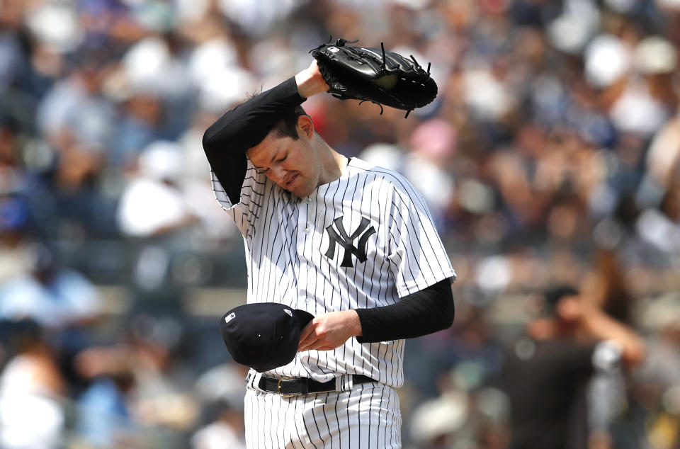 New York Yankees starting pitcher Jordan Montgomery pauses before pitching against the Kansas City Royals during the fifth inning of a baseball game Sunday, July 31, 2022, in New York. (AP Photo/Noah K. Murray)