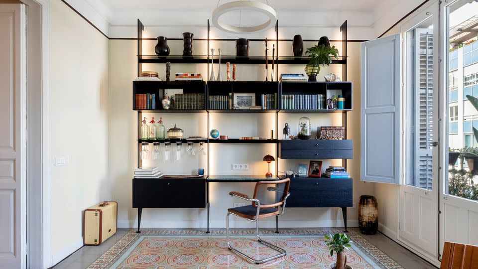 Colorful tile throughout the apartment helps delineate different living spaces, including this work area. - Jordi Folch