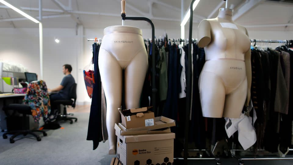 Mannequins for making plus-size dresses hang next to clothing samples at Specialty Fashion Group headquarters in Sydney on December 5, 2012. - Tim Wimborne/Reuters