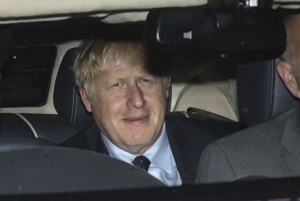 Prime Minister Boris Johnson leaves the House of Commons in London, Tuesday, Sept. 3, 2019, after MPs voted in favor of allowing a cross-party alliance to take control of the Commons agenda on Wednesday in a bid to block a no-deal Brexit on October 31. (Aaron Chown/PA via AP)