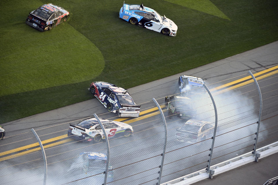 William Byron (24), Martin Truex Jr. (19) and Kurt Busch (1) are involved in a multi-car accident along the front stretch after a restart from an earlier accident during the NASCAR Daytona Clash auto race at Daytona International Speedway, Sunday, Feb. 9, 2020, in Daytona Beach, Fla. (AP Photo/Phelan M. Ebenhack)