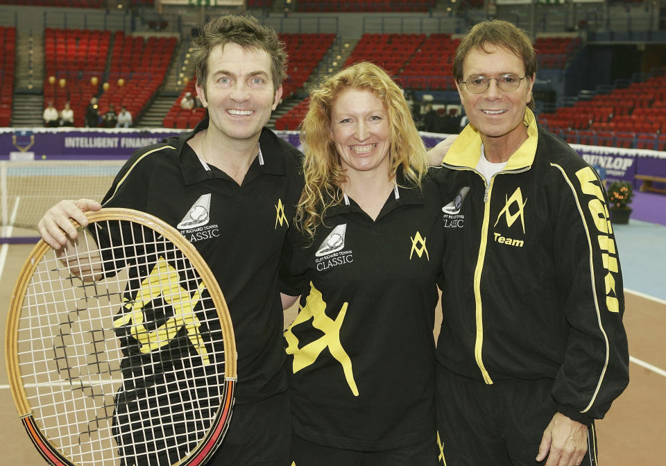 BIRMINGHAM, ENGLAND - DECEMBER 18: Bradley Walsh, Charlie Dimmock and Cliff Richard pose at a photocall ahead of the "Intelligent Finance Cliff Richard Tennis Classic" at Birmingham National Indoor Arena on December 18, 2004 in Birmingham, England. The annual tournament raises money for the Cliff Richard Tennis Foundation, which introduces children across the country to the game. (Photo by MJ Kim/Getty Images) 