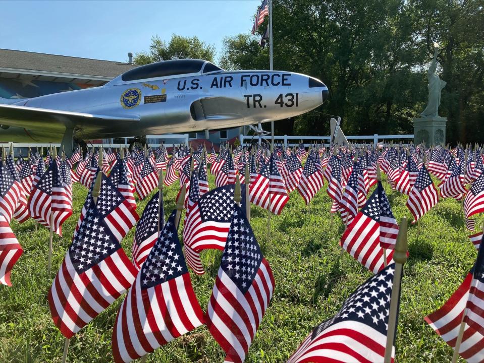 American Legion Walter L. Fox Post 2 displays commemorative flags outside.