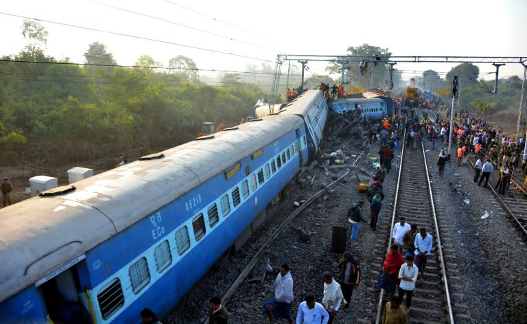 Rescue workers search for victims at the site of the derailment of the Jagdalpur-Bhubaneswar express train near Kuneru station in Andhra Pradesh state, southern India on January 22, 2017