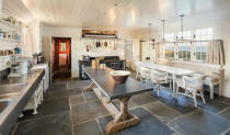<p>Klutzes should give this kitchen a wide berth; the flagstone flooring wouldn’t be kind to dropped dishes. (Credit: <a href="http://bit.ly/1NSd4Bv" rel="nofollow noopener" target="_blank" data-ylk="slk:Douglas Elliman Real Estate listing;elm:context_link;itc:0;sec:content-canvas" class="link ">Douglas Elliman Real Estate listing</a>)</p>