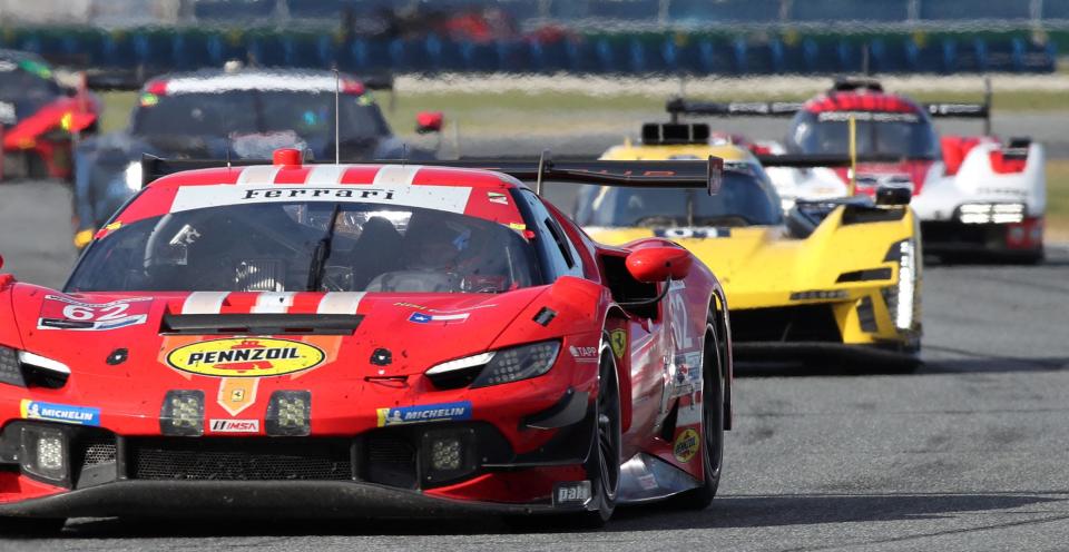 The No. 62 Ferrari 296 GT3 leads a pack through the west end of the infield, Saturday, January 27, 2024 during the Rolex 24 at Daytona International Speedway.