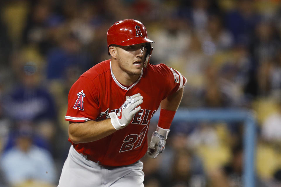 Mike Trout sporting the C-Flap on his helmet to help protect his face and head from wild pitches. (AP Photo)