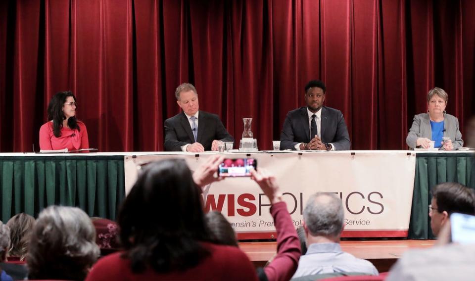 From left, Wisconsin state Supreme Court candidates Waukesha County Judge Jennifer Dorow, former Wisconsin Supreme Court Justice Dan Kelly, Dane County Judge Everett Mitchell, and Milwaukee County Judge Janet Protasiewicz participate in a forum at Monona Terrace in Madison, Wis., Jan. 9, 2023.