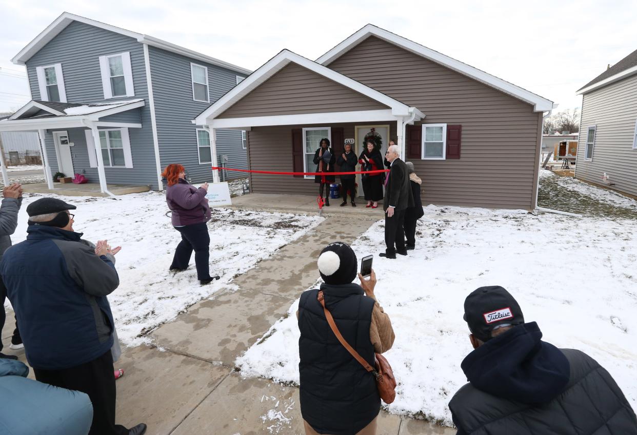 A ceremony for the latest new homeowner to move into a house built by Habitat for Humanity of St. Joseph County takes place Wednesday, Dec. 20, 2023, on Yearwood Lane in Mishawaka. Ryan Durham received the keys to her new house, one of 12 that were built in 2023, according to Habitat officials.