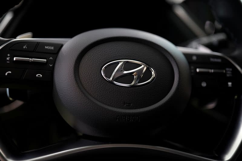FILE PHOTO: The logo of Hyundai Motors is seen on a steering wheel of a all-new Sonata sedan on display at the company's headquarters in Seoul