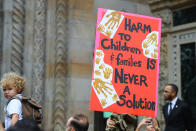 <p>A protester holds up sign during a march towards the United Nations on E. 42nd Street in New York City on June 20, 2018. (Photo: Gordon Donovan/Yahoo News) </p>