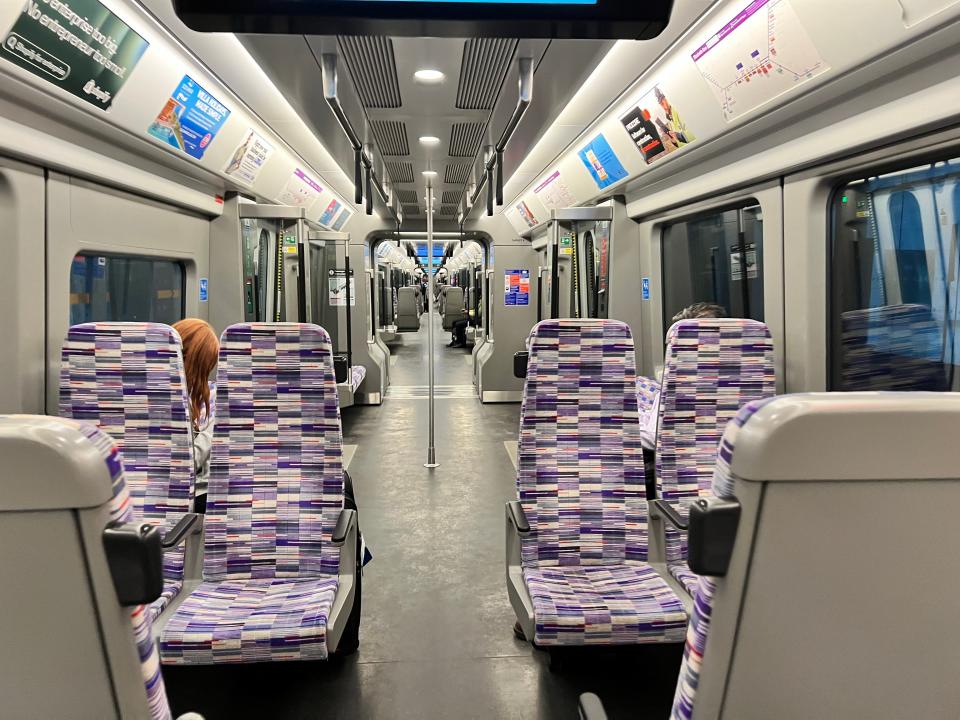 An empty Elizabeth line train in London as viewed down the aisle