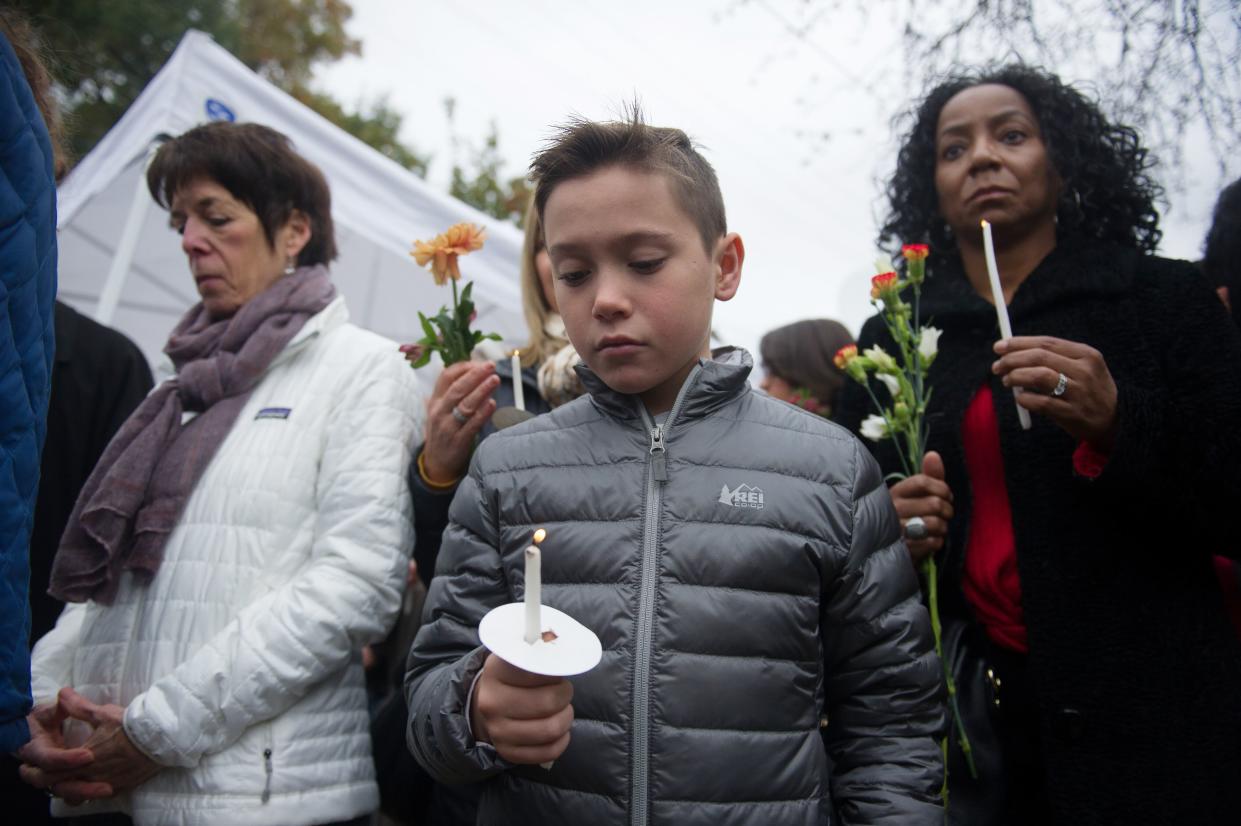 People hold candles outside the Tree of Life synagogue on Oct. 28, 2018, a day after the mass shooting in Pittsburgh. (Photo: Vincent Pugliese/EPA-EFE/Rex/Shutterstock)