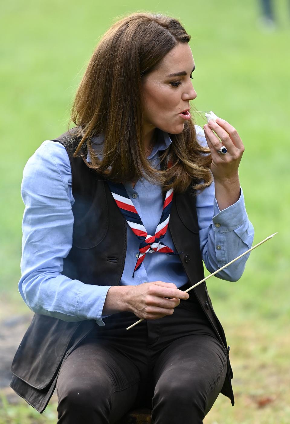 Britain's Catherine, Duchess of Cambridge, toasts marshmallows during her visit to a Scout Group in Northolt, northwest London on September 29, 2020, where she joined Cub and Beaver Scouts in outdoor activities. - The Duchess learned how the Scouts have adapted during the COVID-19 pandemic, and continued Scouting sessions and online activities. (Photo by DANIEL LEAL-OLIVAS / various sources / AFP) (Photo by DANIEL LEAL-OLIVAS/AFP via Getty Images)