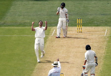 Australia's Mitchell Starc (L) celebrates dismissing New Zealand's Kane Williamson (TOP) LBW for 22 runs during the first day of the third cricket test match at the Adelaide Oval, in South Australia, November 27, 2015. REUTERS/David Gray