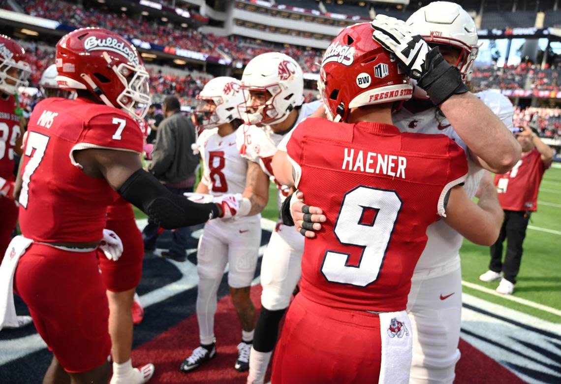 Fresno State’s Jake Heaner, right, even after the coin toss against Washington State at the Jimmy Kimmel LA Bowl Saturday, Dec. 17, 2022 in Inglewood, CA.