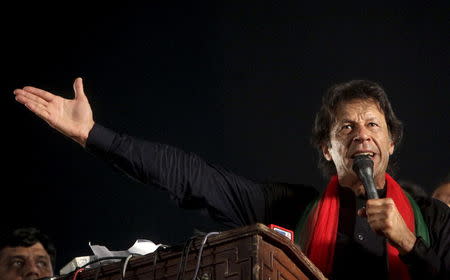 Imran Khan, cricketer-turned-politician and chairman of the Pakistan Tehreek-e-Insaf (PTI) political party, addresses his supporters during a by-election campaign rally in Lahore, Pakistan, October 9, 2015. REUTERS/Mohsin Raza