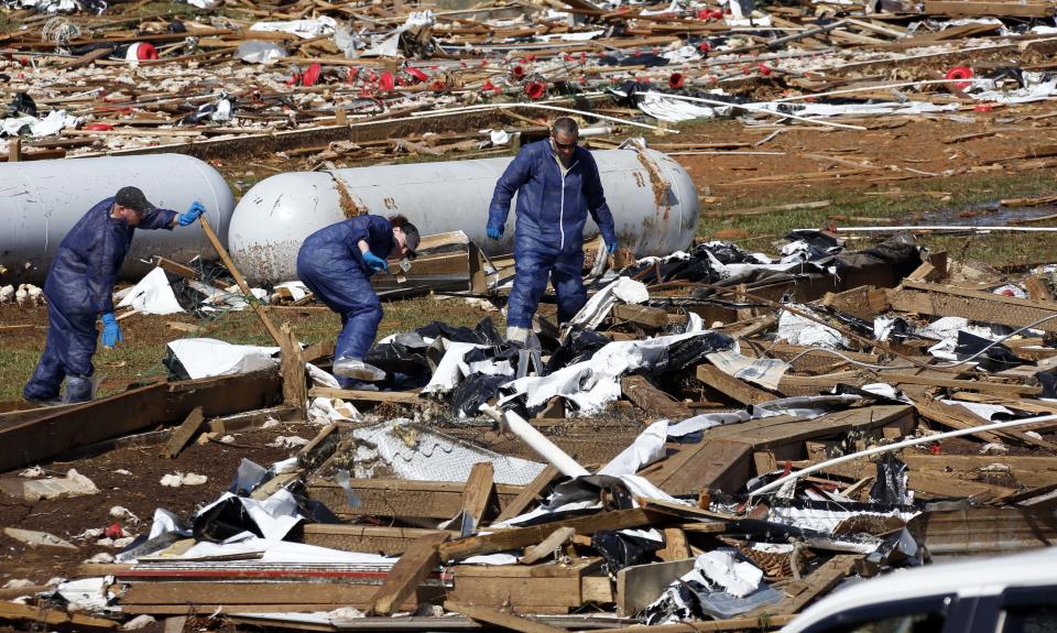 Tyson Foods workers continue tornado cleanup at Wilkes Farm,d in Noxapater, Miss., Wednesday, April 30, 2014. The farm raises broilers for Tyson and each house has 28, 500 chickens. Several poultry raising farms near Louisville were damaged or destroyed by tornadoes Monday. (AP Photo/Rogelio V. Solis)
