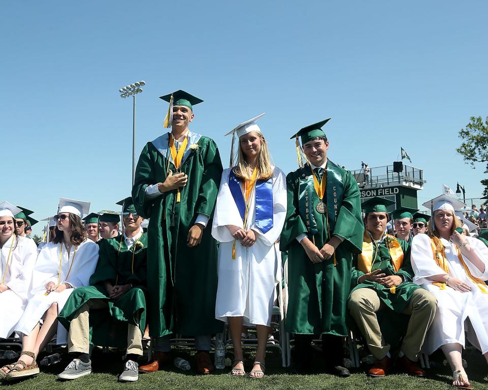 Blake Horne, Sydney McCabe, and Sam Ryan are recognized during Marshfield High's graduation Saturday, June 4, 2022.