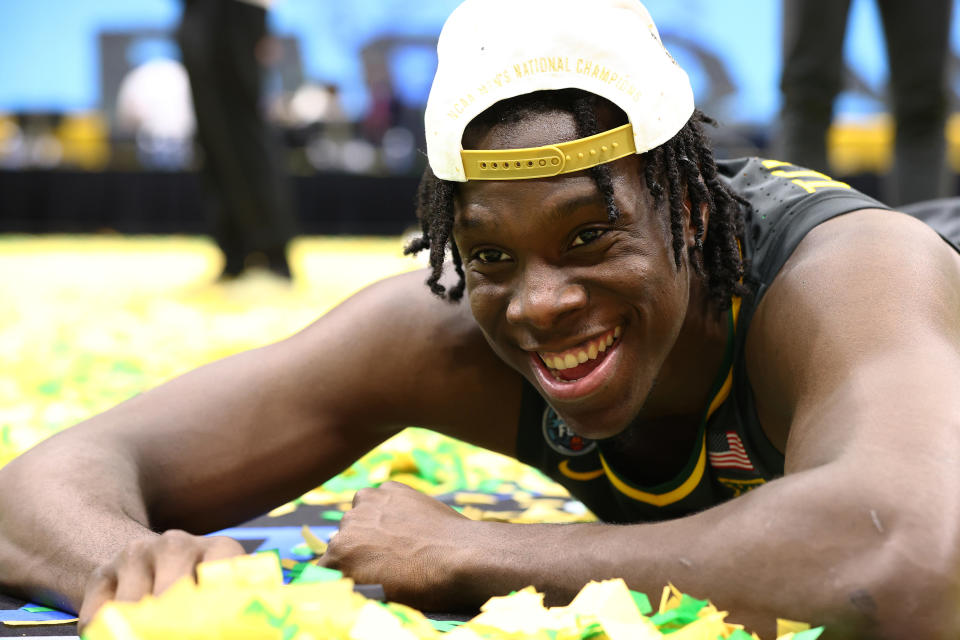 INDIANAPOLIS, INDIANA - APRIL 05: Jonathan Tchamwa Tchatchoua #23 of the Baylor Bears plays in the confetti after his team's win against the Gonzaga Bulldogs in the National Championship game of the 2021 NCAA Men's Basketball Tournament at Lucas Oil Stadium on April 05, 2021 in Indianapolis, Indiana. (Photo by Jamie Schwaberow/NCAA Photos via Getty Images)