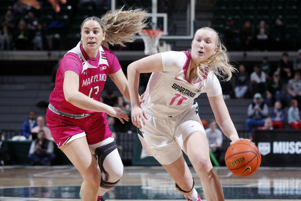 Michigan State's Matilda Ekh, right, drives against Maryland's Faith Masonius during the first half of an NCAA college basketball game, Saturday, Feb. 18, 2023, in East Lansing, Mich. (AP Photo/Al Goldis)