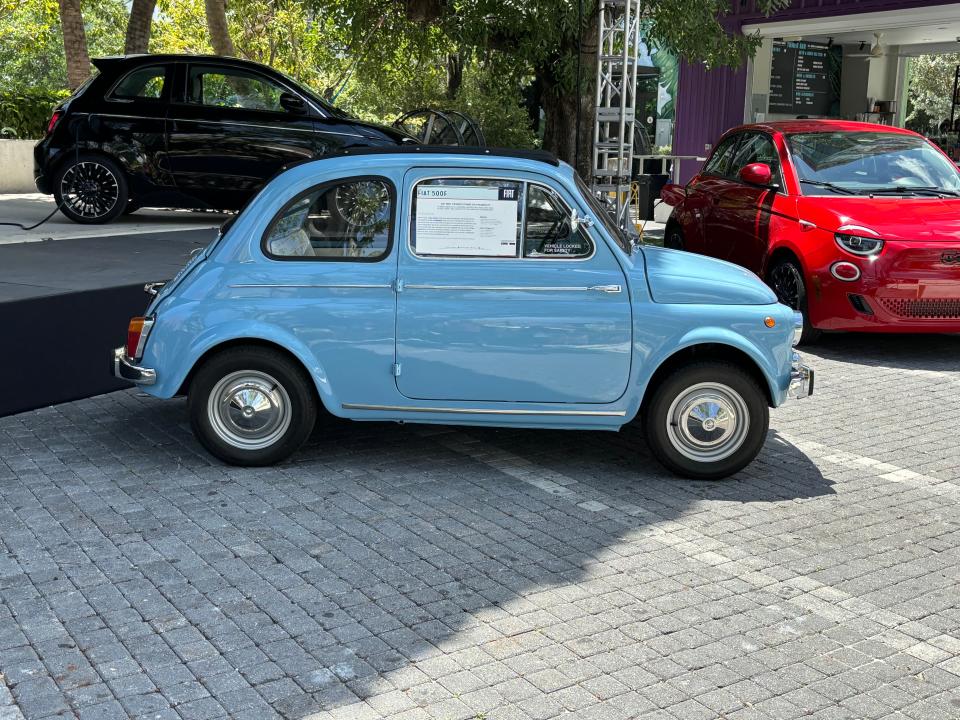 The first-generation Fiat 500 helped put Italy back on wheels after WWII. It's dwarfed by the 2024 500e mini-compact electric car.