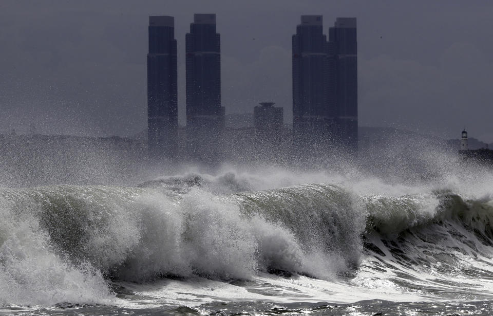 High waves crash onto Haeundae Beach in Busan, South Korea, Wednesday, Aug. 26, 2020, as Typhoon Bavi approaches the Korean Peninsula. Hundreds of flights were canceled in South Korea while North Korea's leader expressed concern about a potential loss of lives and crops as the countries braced for a fast-approaching typhoon forecast as one of the strongest to hit their peninsula this year.(Jo Jong-ho/Yonhap via AP)