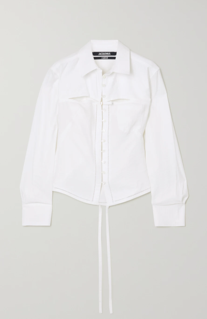 <p><strong>Jacquemus</strong></p><p>net-a-porter.com</p><p><a href="https://go.redirectingat.com?id=74968X1596630&url=https%3A%2F%2Fwww.net-a-porter.com%2Fen-us%2Fshop%2Fproduct%2Fjacquemus%2Fclothing%2Fshirts%2Fnappe-tie-detailed-cutout-woven-shirt%2F23471478575805087&sref=https%3A%2F%2Fwww.harpersbazaar.com%2Ffashion%2Ftrends%2Fg38319160%2Fnet-a-porter-black-friday-sale-2021%2F" rel="nofollow noopener" target="_blank" data-ylk="slk:Shop Now" class="link rapid-noclick-resp">Shop Now</a></p><p><strong><del>$590</del> $413 (30% off)</strong></p><p>A straight-from-the-runway Jacquemus style that blends lingerie influences and classic <a href="https://www.harpersbazaar.com/fashion/trends/a38284931/ayr-shirts-review/" rel="nofollow noopener" target="_blank" data-ylk="slk:button-down" class="link rapid-noclick-resp">button-down</a> features into an elegant top. </p>