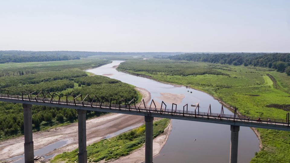 A handful of RAGBRAI 50 cyclists take a detour to the High Trestle Trail Bridge on Wednesday morning, July 26, 2023, outside of Madrid.