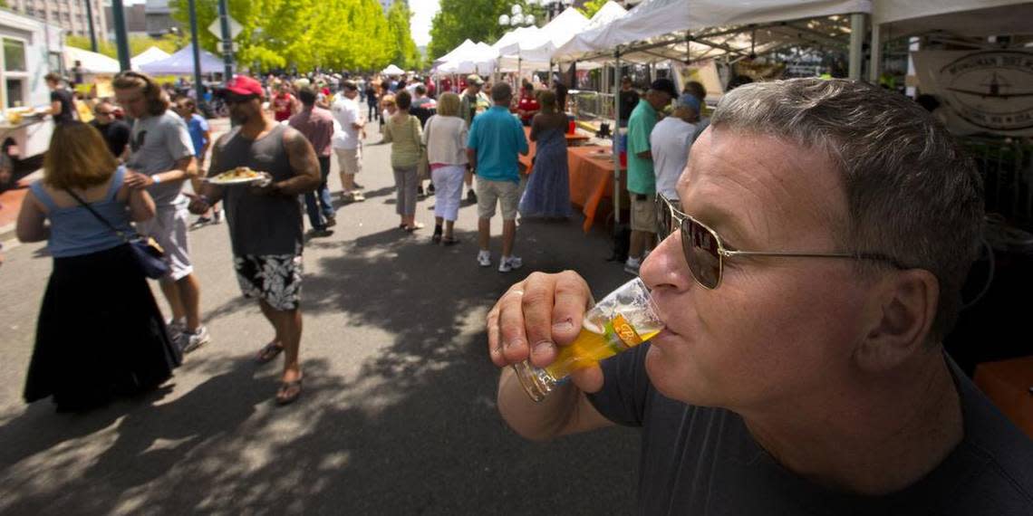 John Mabbott of Auburn takes a sip at Brew Five Three in 2013. Tacoma Beer Week’s signature street festival returns Aug. 6 to Broadway between 9th and 11th for the first time since 2019.