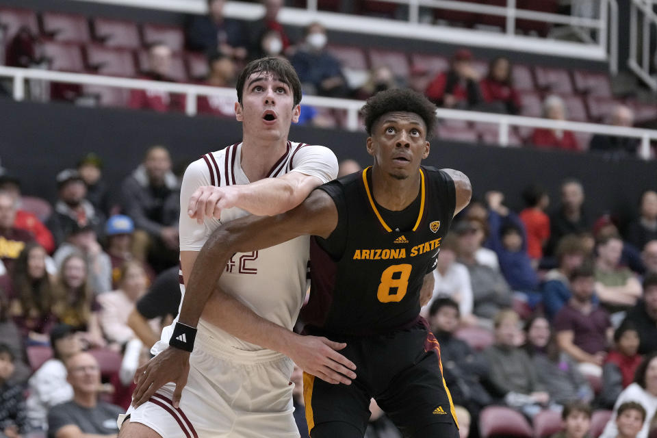 Stanford forward Maxime Raynaud (42) and Arizona State forward Alonzo Gaffney (8) wait for a rebound during the second half of an NCAA college basketball game Friday, Dec. 29, 2023, in Stanford, Calif. (AP Photo/Tony Avelar)