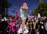 Britney Spears supporters celebrate following a hearing concerning the pop singer's conservatorship at the Stanley Mosk Courthouse, Friday, Nov. 12, 2021, in Los Angeles. A Los Angeles judge on Friday ended the conservatorship that has controlled Britney Spears' life and money for nearly 14 years. (AP Photo/Chris Pizzello)