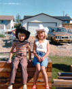 This circa 1981 photo provided by Carol Tapanila shows her children wearing cowboy hats in Airdrie, Alberta, Canada for the Calgary Stampede event. After retiring from a job as an administrative assistant at an oil company in Calgary, Carol Tapanila, still a U.S. citizen, began putting $125 a month into a special savings account for her developmentally disabled son, left, matched by the Canadian government. But in 2012 she turned in her U.S. passport, renouncing citizenship to protect money saved for her retirement and her son. Tapanila, 70, has tried and failed to renounce U.S. citizenship on his behalf, saying officials told her such a decision must be made by the individual. "I'm sorry that I've given my son this burden and I can do nothing about it ... I thought we had some rights to go wherever we wanted to go and some choices we could make in our lives. I thought that was democracy. Apparently, I’ve got it all wrong." (AP Photo/Carol Tapanila)