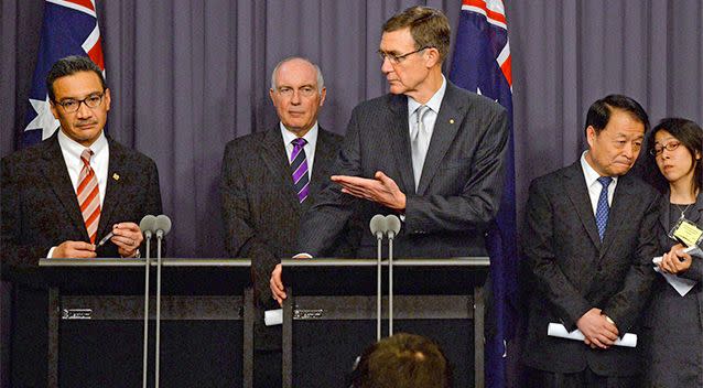 Australia's Transport Minister Warren Truss, second from left, Malaysia's acting Transport Minister Hishammuddin Hussein, left, and China's Transport Minister Yang Chuantang, second from right, attend a press conference for the nearly two-month-old hunt for the missing Malaysian jet with search coordinator Angus Houston, centre, in Canberra. Photo: AP.