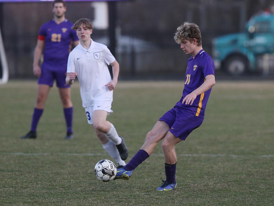 Nevada's defender Jackson Reid (11) clears the ball against Bondurant-Farrer during the first half at Nevada High School Friday, April 7, 2023, in Nevada, Iowa.