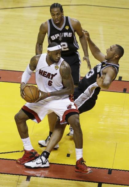 Just about everything fell right for the Spurs, to the chagrin of LeBron James and the Heat. (AP) 