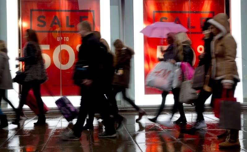 Pedestrians walk past a store on Oxford Street in central London. Picture: Reuters.