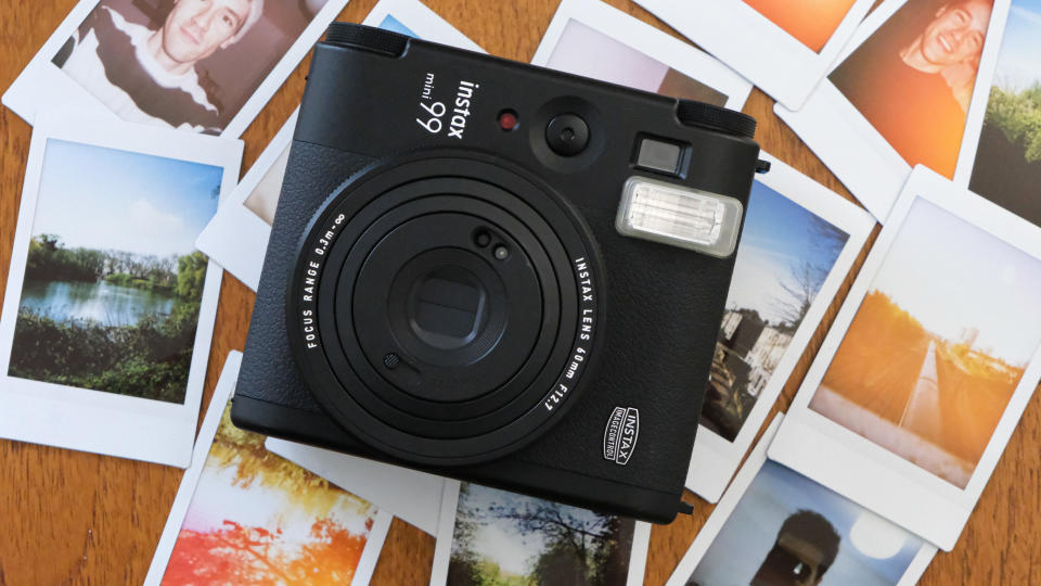 Fujifilm Instax Mini 99 surrounded by Instax Mini prints