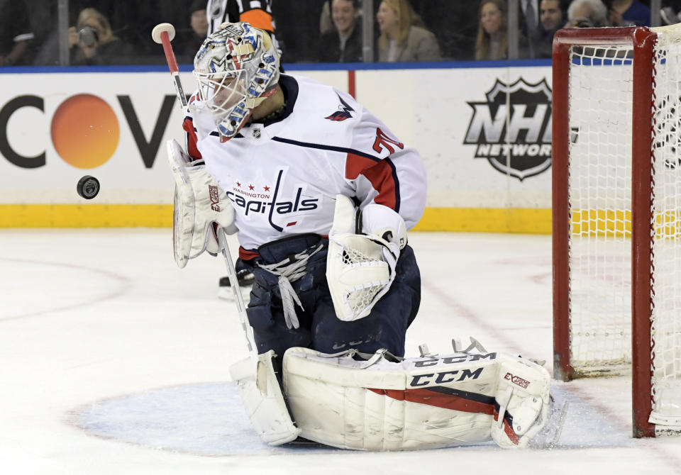 Washington Capitals goaltender Braden Holtby (70) stops the puck during the second period of an NHL hockey game against the New York Rangers, Sunday, March 3, 2019, at Madison Square Garden in New York. (AP Photo/ Bill Kostroun)